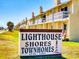 Lighthouse Shores Townhomes signage, with view of property's exterior at 4752 S Atlantic Ave # 1, Ponce Inlet, FL 32127