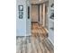 Hallway view featuring beautiful wood-look floors and neutral paint at 5300 S Atlantic Ave # 3-405, New Smyrna Beach, FL 32169