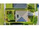 An aerial view of a single-Gathering home, highlighting the solar panels on the roof and manicured yard at 5304 Cordgrass Bend Ln, Port Orange, FL 32128
