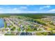 Aerial view of a residential neighborhood with homes, ponds, and green spaces at 5304 Cordgrass Bend Ln, Port Orange, FL 32128