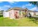 A charming home featuring a manicured lawn and beautiful landscaping around the exterior at 5304 Cordgrass Bend Ln, Port Orange, FL 32128