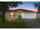 Charming single-story home with well-maintained landscaping and a two-car garage at 5304 Cordgrass Bend Ln, Port Orange, FL 32128