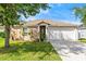 Charming single-story home with a well-manicured lawn and beautiful landscaping at 5304 Cordgrass Bend Ln, Port Orange, FL 32128
