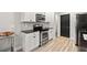 Bright kitchen with stainless steel oven and appliances, granite countertops, and white cabinets at 5304 Cordgrass Bend Ln, Port Orange, FL 32128