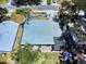 Aerial view showcasing a home's roof, backyard patio, and landscaping at 650 S Pine St, New Smyrna Beach, FL 32169