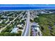 Amazing aerial view featuring a coastal community, commercial area, and beautiful blue ocean backdrop at 650 S Pine St, New Smyrna Beach, FL 32169