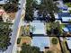 An aerial view of a neighborhood with houses featuring gray metal roofs and well-maintained yards at 650 S Pine St, New Smyrna Beach, FL 32169