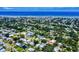 Expansive aerial view showcasing a coastal community with lush greenery and the ocean in the backdrop at 650 S Pine St, New Smyrna Beach, FL 32169