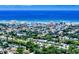 Coastal cityscape featuring buildings and the ocean, with lush greenery and residential areas in the foreground at 650 S Pine St, New Smyrna Beach, FL 32169