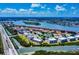 Stunning aerial view featuring waterfront condominiums and an ocean inlet surrounded by lush landscapes at 650 S Pine St, New Smyrna Beach, FL 32169