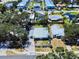 Aerial shot displays the neighborhood's layout, nearby amenities, and the home's placement amongst the community at 650 S Pine St, New Smyrna Beach, FL 32169
