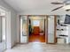 Well-lit bedroom featuring tile floors and closet with mirrored doors at 650 S Pine St, New Smyrna Beach, FL 32169