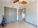 Bedroom featuring tile floors, closet, access door, and modern ceiling fan for comfortable living at 650 S Pine St, New Smyrna Beach, FL 32169