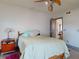 Bedroom featuring closet, access door, light color walls, tile floor, and a modern ceiling fan at 650 S Pine St, New Smyrna Beach, FL 32169