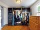 Organized closet featuring shelves, hanging racks and a chest of drawers at 650 S Pine St, New Smyrna Beach, FL 32169