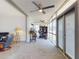 Florida room with large windows, comfortable seating, desk and outdoor views at 650 S Pine St, New Smyrna Beach, FL 32169