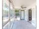 Sunroom with floor-to-ceiling windows and tile flooring at 650 S Pine St, New Smyrna Beach, FL 32169