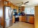 Spacious kitchen featuring stainless steel appliances and ample cabinet space and granite counters at 650 S Pine St, New Smyrna Beach, FL 32169