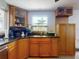 Kitchen boasts granite countertops and abundant cabinet space, complemented by modern fixtures at 650 S Pine St, New Smyrna Beach, FL 32169