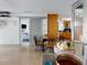 Cozy living room with terrazzo floors and view to kitchen and bedroom at 650 S Pine St, New Smyrna Beach, FL 32169
