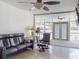 Living room featuring a comfortable leather sofa and great natural light at 650 S Pine St, New Smyrna Beach, FL 32169