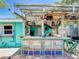 Outdoor bar area featuring custom chairs, unique decorations and lighting, perfect for entertaining guests at 650 S Pine St, New Smyrna Beach, FL 32169