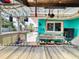 Outdoor bar area featuring a window to the home, stainless steel sink and counter space at 650 S Pine St, New Smyrna Beach, FL 32169