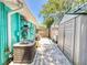 Side yard with a privacy fence, AC unit, and storage shed at 650 S Pine St, New Smyrna Beach, FL 32169