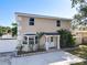 Two-story home with bay window, neat landscaping, a well-maintained lawn and covered front entrance at 653 Sweetwood Dr, Port Orange, FL 32127