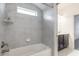 Bathroom showcasing a tiled shower/tub, granite counters, and modern fixtures at 6808 Forkmead Ln, Port Orange, FL 32128