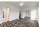 Bright bedroom featuring hardwood floors, ceiling fan and sliding closet doors at 6808 Forkmead Ln, Port Orange, FL 32128