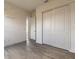Bright bedroom with light gray flooring and a spacious closet with sliding doors at 6808 Forkmead Ln, Port Orange, FL 32128