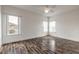 Bright bedroom with light hardwood floors, dual windows, and neutral walls at 6808 Forkmead Ln, Port Orange, FL 32128