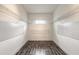Walk in closet with wire shelving and hardwood floors at 6808 Forkmead Ln, Port Orange, FL 32128