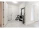 Bright entryway features white walls, tile floor, and a decorative bench at 6808 Forkmead Ln, Port Orange, FL 32128