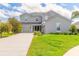Charming two-story home with landscaped front yard, attached garage, and covered entryway at 6808 Forkmead Ln, Port Orange, FL 32128