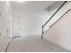 Bright, spacious foyer with tile floors and a staircase with white railings at 6808 Forkmead Ln, Port Orange, FL 32128