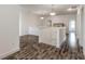 Hallway featuring hardwood floors and pendant lighting at 6808 Forkmead Ln, Port Orange, FL 32128