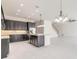 Modern kitchen flows into the living area, featuring stainless appliances and ample lighting at 6808 Forkmead Ln, Port Orange, FL 32128