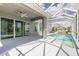 A refreshing screened-in pool with a covered patio is ideal for relaxation at 6808 Forkmead Ln, Port Orange, FL 32128