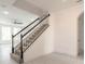 Staircase with plush carpeting and white and black railings and trim at 6808 Forkmead Ln, Port Orange, FL 32128