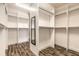 Spacious walk-in closet with custom shelving and a full length mirror at 6808 Forkmead Ln, Port Orange, FL 32128