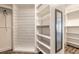 Well-organized walk-in closet with white shelving and hanging rods at 6808 Forkmead Ln, Port Orange, FL 32128