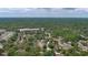 Aerial view of a quiet residential area with many mature trees and single-Gathering homes at 1119 Wild Oak Ter, Deland, FL 32720