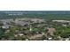 Wide aerial view of a neighborhood close to Lake Beresford with many trees and residential homes at 1119 Wild Oak Ter, Deland, FL 32720