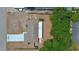 Aerial view of a home featuring a driveway, brown roof, and generously sized backyard with mature trees at 1119 Wild Oak Ter, Deland, FL 32720