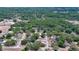 Aerial view of a residential neighborhood with tree-lined streets and various single-Gathering homes at 1119 Wild Oak Ter, Deland, FL 32720