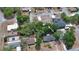 Aerial view of a home and surrounding neighborhood with mature trees in a residential area at 1119 Wild Oak Ter, Deland, FL 32720