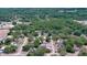 Aerial view of a neighborhood with tree-lined streets and neatly arranged single-Gathering homes at 1119 Wild Oak Ter, Deland, FL 32720
