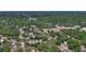 Aerial view of a residential area featuring tree-lined streets and various single-Gathering homes at 1119 Wild Oak Ter, Deland, FL 32720